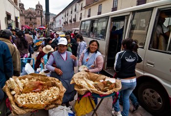 Working together to sell pork rinds outside Cusco mercado (2011) Photo (c) Karen Abrahamson Working together to sell pork rinds outside Cusco mercado (2011) Photo (c) Karen Abrahamson